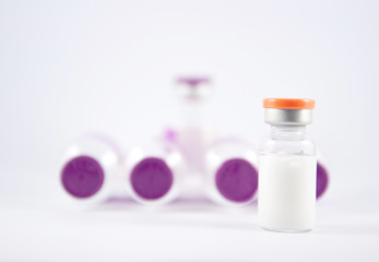 purple cap injection vial show medicine concept