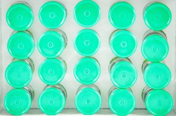 Fototapeta premium Closed up top view of injection vials on paper tray