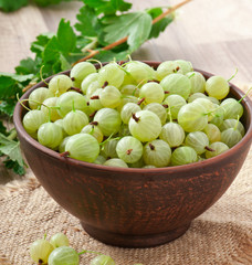 green gooseberries in a ceramic bowl