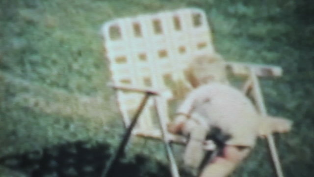 Boy Enjoys Playing Outside In The Yard-1963 Vintage 8mm film