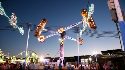 Fairground ride in an amusement park in the evening