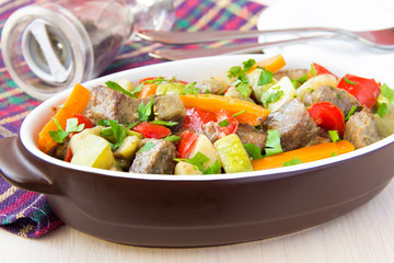 Braised meat stew with beef and vegetables in pot