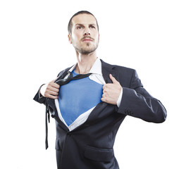 Young businessman acting like a super hero and tearing his shirt