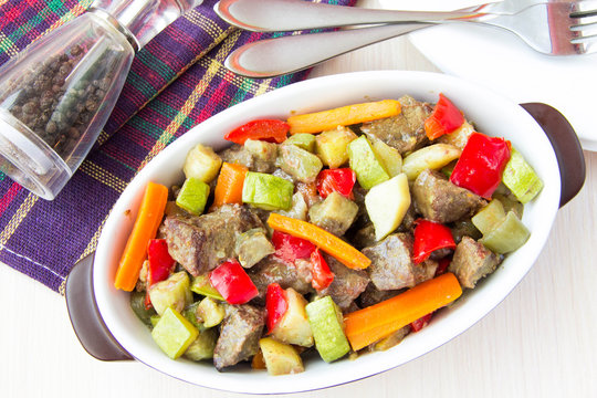 Braised meat stew with beef and vegetables in pot