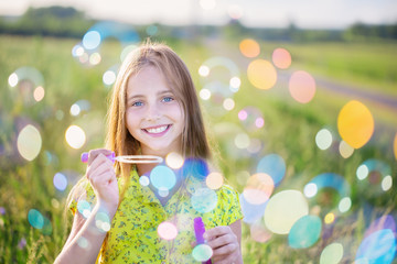 happy girl with soap bubbles