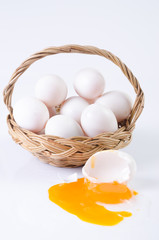 Fresh, eggs in basket on white background