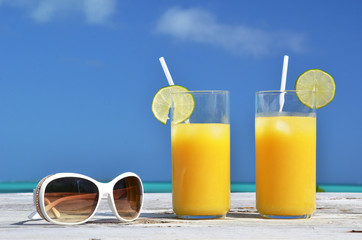 Sunglasses and orange juice