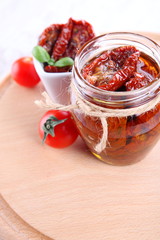 Sun dried tomatoes with olive oil in a jar