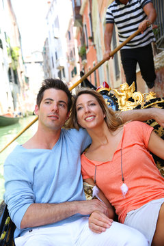 Couple in Venice having a Gondola ride on the canal