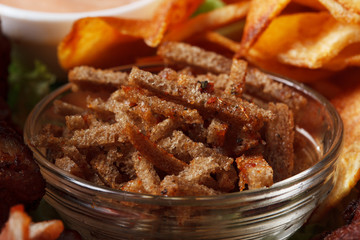 Bowl with appetizing spicy rye crackers