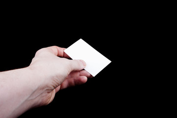 Blank business card in hand.