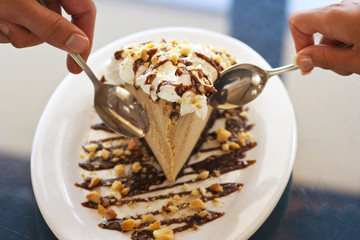 couple share a slice of macadamia nut mud pie