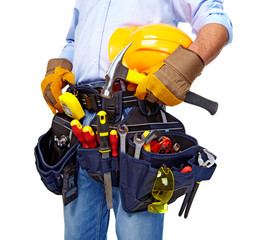 Worker with a tool belt. Construction.