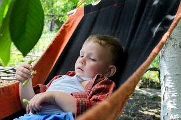 Small boy relaxing in a hammock