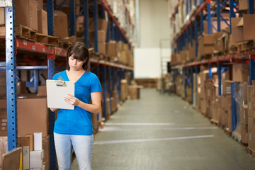 Female Worker In Distribution Warehouse