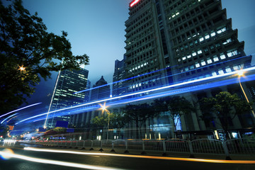 Fototapeta na wymiar View traffic through modern city at night in shanghai