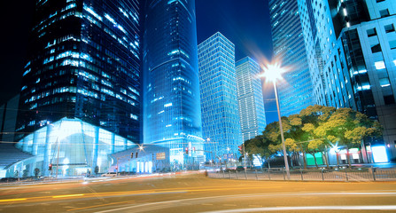 Dreamy blue of modern office buildings at night in Shanghai