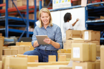 Workers In Warehouse Preparing Goods For Dispatch