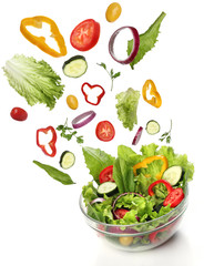 Falling fresh vegetables. Healthy salad isolated
