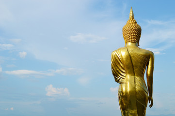 Buddha standing on a mountain Wat Phra That Khao Noi