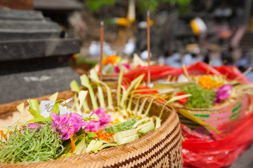 Offerings to gods in Bali with flowers, food and aroma sticks