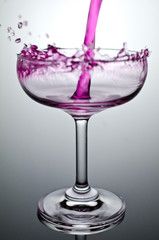 Filling a glass with water showing a drink concept