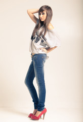 woman wearing jeans and t-shirt with an inscription love