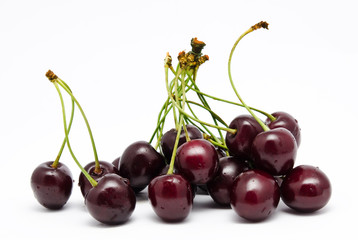 Heap of ripe sweet cherry isolated on a white