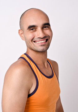 Portrait of a man smiling.Athletic  bald man laughing.