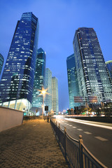 The light trails on modern office building background