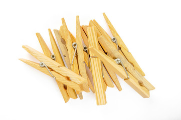 A little heap of wooden clothespin isolated on white background