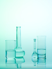 laboratory glass utensils on blue background