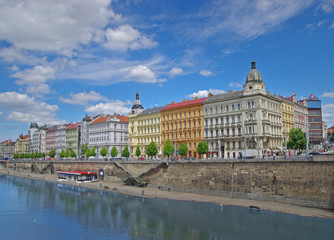 Fototapeta na wymiar View of historic buildings and river in Prague, Czech Republic