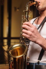 Obraz premium He likes to improvise on his saxophone. Close-up shot of men hol