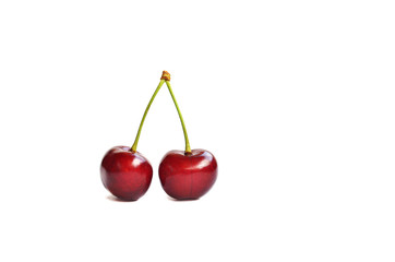 two red cherries on a white background