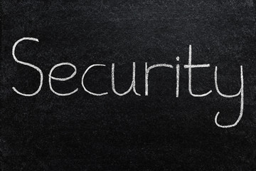 Security, written with white chalk on a blackboard.