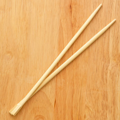 Chinese sticks on a wooden board