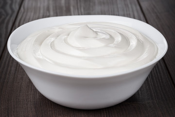 white bowl full of sour cream