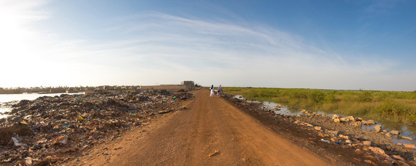 Obraz premium Two women walking on an empty road