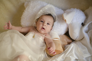 Bbay with christening cap lying