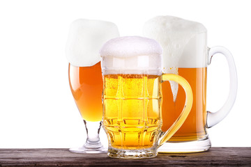 Beer glass on wooden barrel background