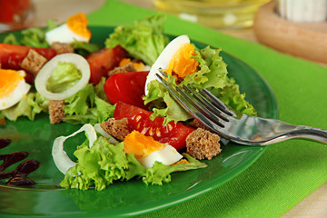 Fresh mixed salad with eggs, tomato, salad leaves and other