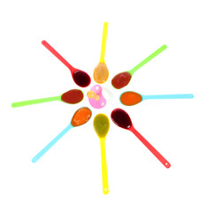 Baby puree in spoons with nipple isolated on white