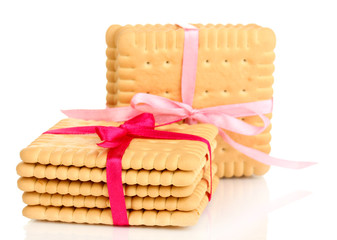Sweet cookies tied with pink ribbons isolated on white