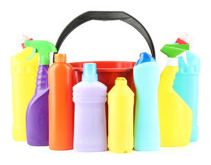 Colorful plastic detergent bottles with bucket, isolated