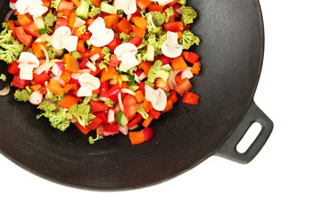 Vegetable ragout in wok, isolated on white