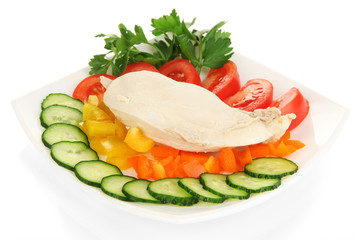 Fototapeta na wymiar Boiled chicken breast on plate with vegetables isolated on