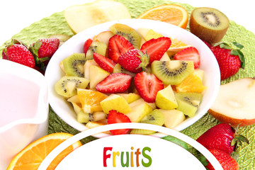 Useful fruit salad of fresh fruits and berries in bowl close-up