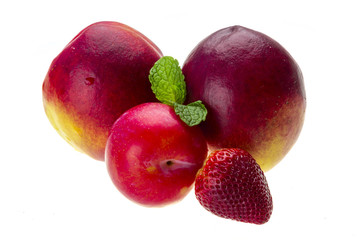 Ripe bright peaches, plum, strawberry and mint