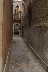 Obraz premium Narrow street in Syracuse, Sicily, Italy